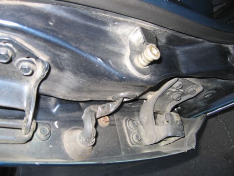 1991 Ford LTD Crown Victoria - Close-up view of the door jamb area, showing the latch mechanism and a wiring harness.