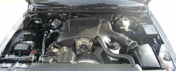 Engine bay of a 2000 Ford Crown Victoria, showing the V8 engine and components