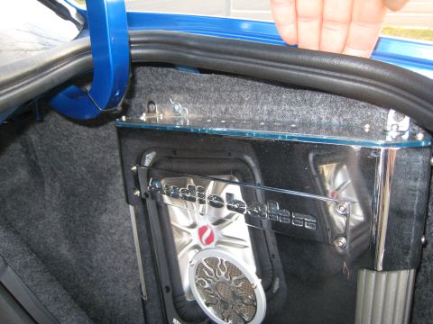2007 Subaru Impreza - Close-up of a car's trunk showing an aftermarket audio system installation.