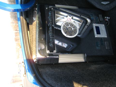 2007 Subaru Impreza - Custom car audio system installed in the interior, an amplifier and a speaker with a decorative grille.