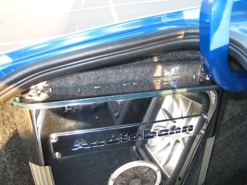 2007 Subaru Impreza - Custom car audio installation in the trunk, an Audiobahn branded panel and speaker.