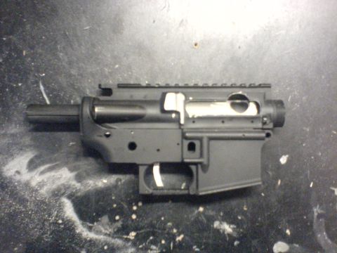 1985 Ford Bronco - AR-15 lower receiver shown on a workbench surface.