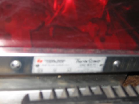 1991 Ford LTD Crown Victoria - A label on a red light bar displays "Federal Signal" and "Ther-Mo-Guard" with other text.