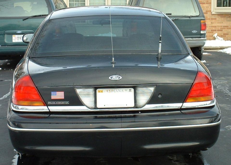 1998 Ford Crown Victoria rear with Indiana license plate and American flag sticker
