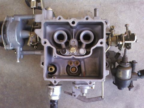 1978 Ford Bronco - Close-up of a Holley carburetor, showing internal components and a FRAM fuel filter.