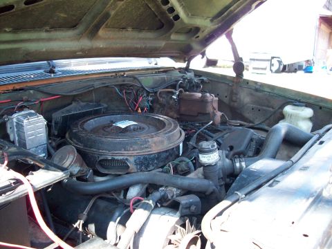 1987 Suzuki Samurai - The engine bay of a vehicle is shown with various components and hoses visible.