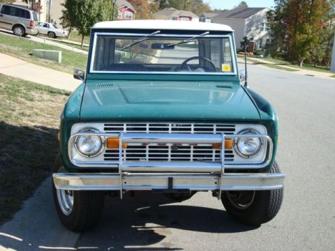 1977 Ford Bronco - Front view of a classic Ford Bronco parked on a suburban street.