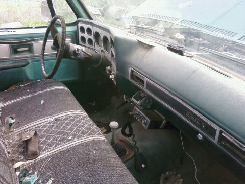 1979 Chevrolet Cheyenne - Interior view of a 1979 Chevrolet Cheyenne pickup truck, the dashboard and seating.