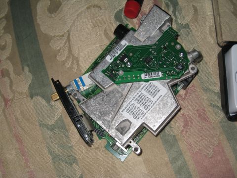 2007 Subaru Impreza - Several electronic circuit boards are piled together on a patterned surface.
