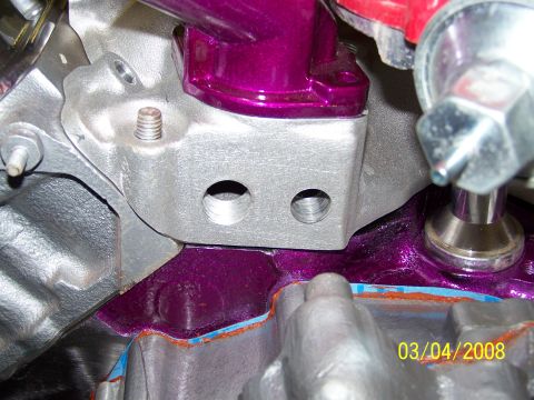 1995 Ford Bronco - Close-up of an engine component vibrant purple accents and a date stamp of 03/04/2008.