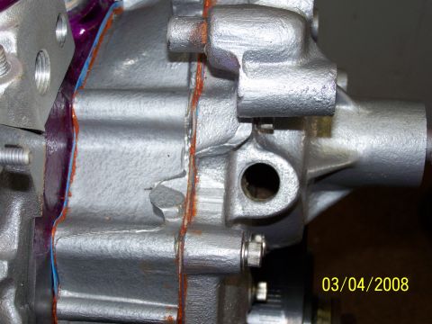 1995 Ford Bronco - Engine part with visible gasket sealant and date stamp 03/04/2008.
