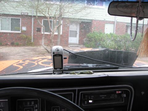 1979 Ford Bronco - Interior view from behind a vehicle's dashboard looking out the windshield, showing a Garmin eTrex Vista GPS unit mounted on the dash, the…