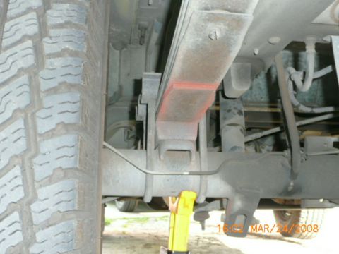 1991 Ford Bronco - This photo shows the underside of a vehicle, focusing on the rear axle and suspension components.
