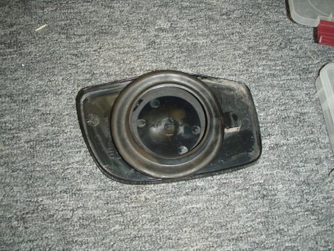 1992 Ford Bronco - picture of the driver side glass mirror removed from the housing. (the back with the rubber motor insulation).