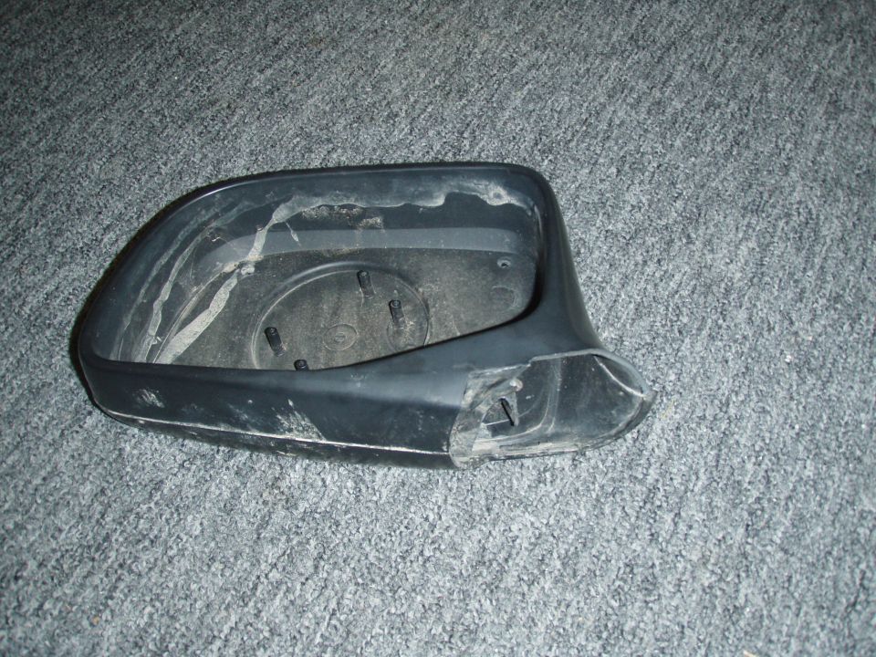 close up of broken mirror housing.