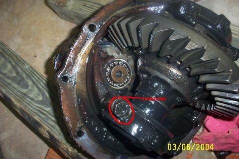 1979 Ford F-150 - Close-up view of a vehicle's differential assembly, showing internal gears and a marked bolt.