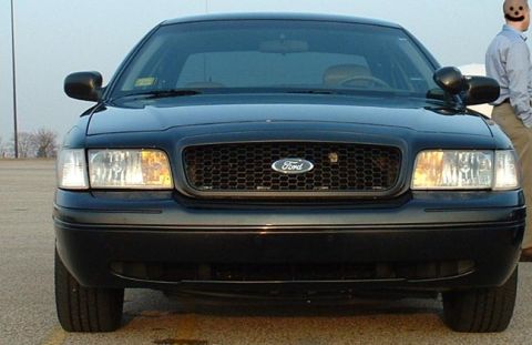 1998 Ford Crown Victoria - Front view of a 1998 Ford Crown Victoria, showing the grille and headlights.