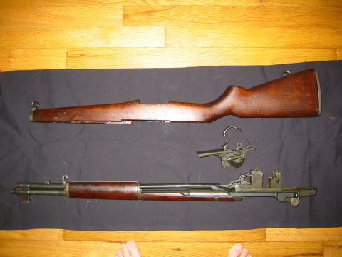 1996 Ford Bronco - Disassembled M1 Garand rifle components shown on a wooden floor.