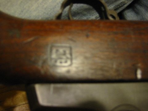 1996 Ford Bronco - A close-up view shows a stamped marking on a wooden surface.