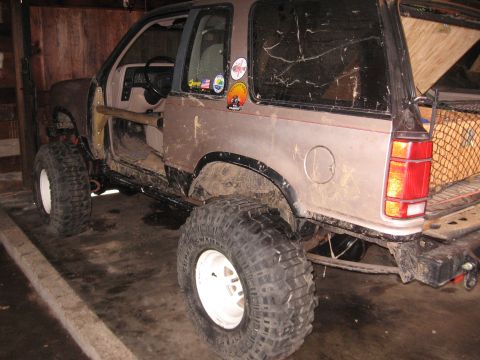 1979 Ford Bronco - This heavily modified SUV features oversized tires and a roll cage, suggesting it's built for off-road use.
