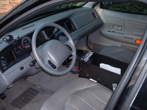 1998 Ford Crown Victoria - Interior view of a 1998 Ford Crown Victoria, the dashboard, steering wheel, and center console.