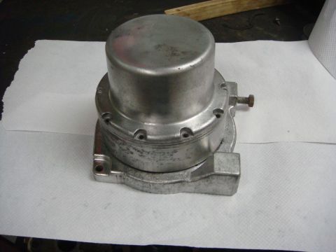1996 Ford Bronco - A metal fuel pump sits on a surface covered with paper towels, ready for installation or repair.