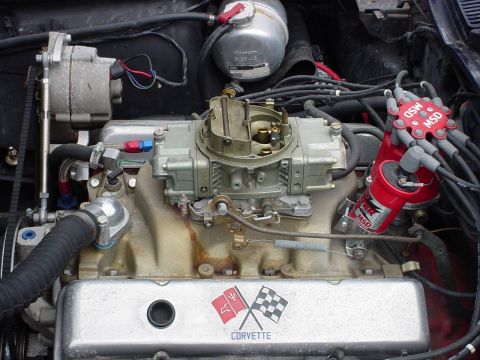 1964 Chevrolet Corvette - Close-up of a Corvette engine bay, a carburetor and MSD ignition system.