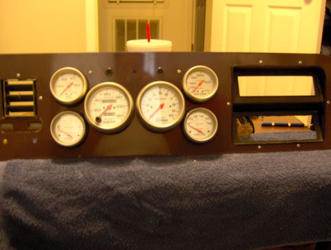1978 Ford Bronco - A custom dashboard panel features multiple gauges and a radio slot, likely for an aftermarket installation.