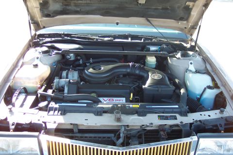2001 Ford Crown Victoria - Engine bay view showing the V8 PFI engine and associated components.