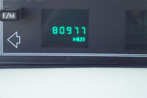 2001 Ford Crown Victoria - Odometer displays 80,977 miles. E/M button and left turn signal indicator are visible.
