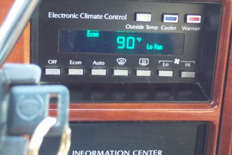 2001 Ford Crown Victoria - The climate control panel displays the current temperature and fan speed, with various button options for climate control settings.