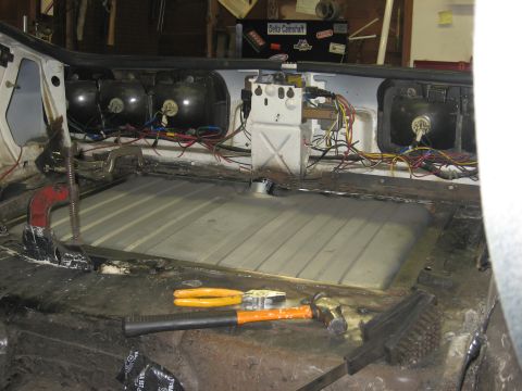1978 Ford Mustang II - Work in progress on a car's interior, with the gas tank removed and tools laid out.