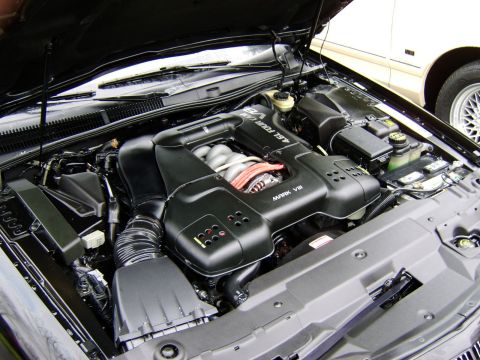 1996 Mercury Grand Marquis - Took advantage of short break from rain to quickly clean and apply dressing to the Mark's engine bay. Was done quickly, as it was already s…