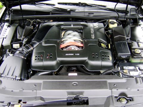 1996 Mercury Grand Marquis - Engine bay detail showing the "MARK VIII" engine cover with "4.6L FOUR CAM V8" text.