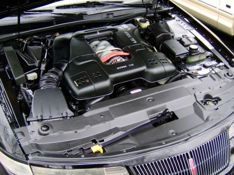 1996 Mercury Grand Marquis - The engine bay of a car, showing the "4.6L FOUR CAM V8 MARK VIII" engine cover.
