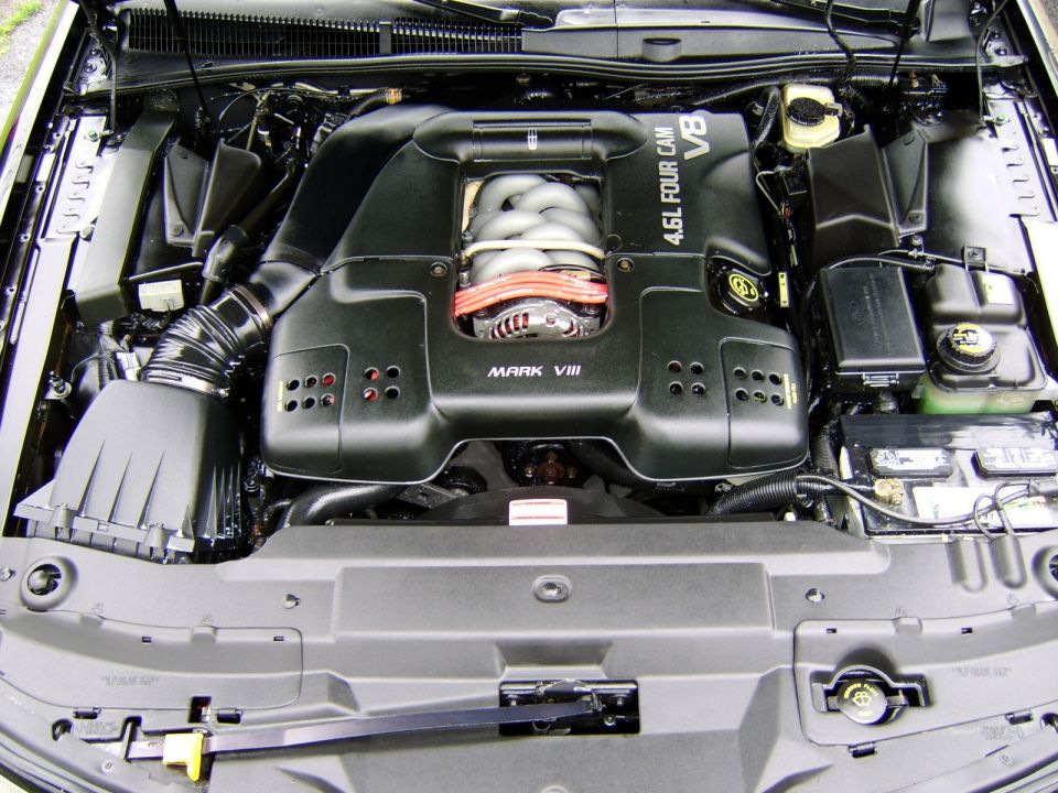 Black 4.6L Four Cam V8 engine bay labeled MARK VIII with Lincoln logo