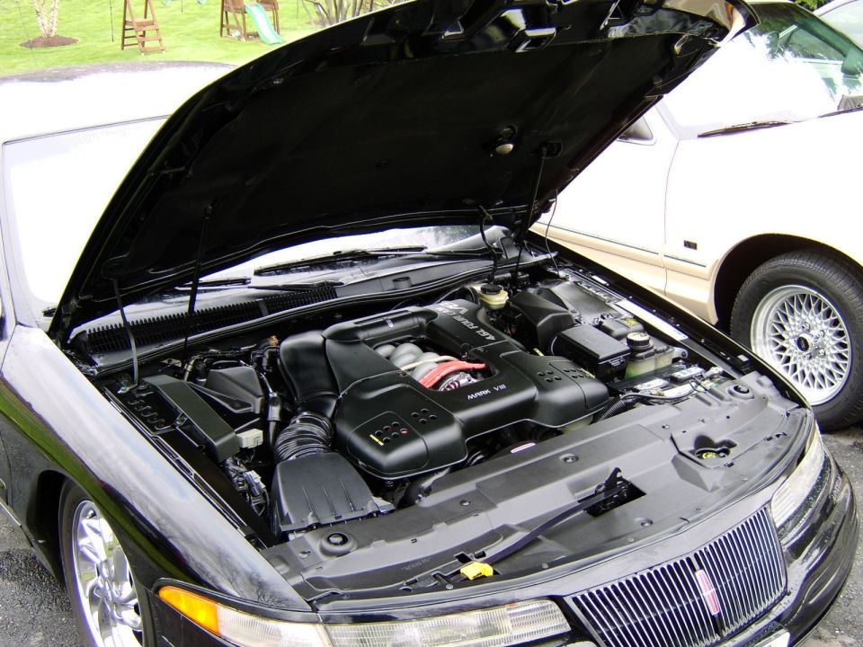 Black Lincoln Mark VIII engine bay with 4.6L V8 and open hood