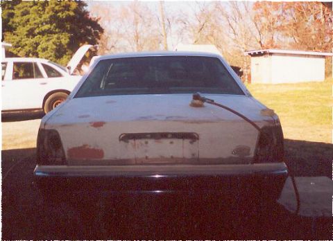 1991 Ford Crown Victoria - The back of the car last year when we just started sanding and filling the holes where the old "crown victoria" emblem was.