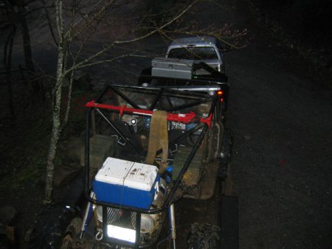 1992 Ford Mustang - Two vehicles, an off-road buggy and a pickup truck, are parked on a dirt road at dusk.