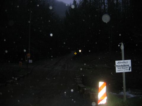 1992 Ford Mustang - A sign for a welding shop is visible next to a dark, rural road at dusk or night.