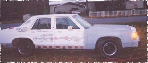1991 Ford Crown Victoria - Ford Crown Victoria in the process of bodywork, showing filler on the front fender and doors.