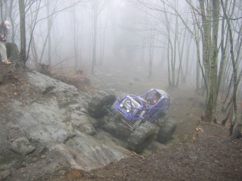 1992 Ford Mustang - A custom-built off-road buggy tackles a challenging trail on a foggy day.