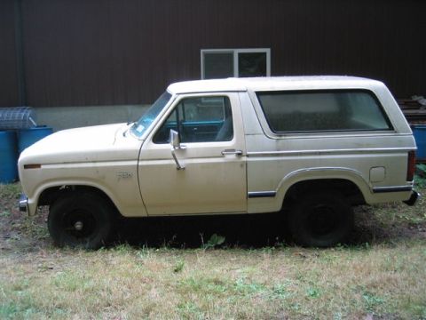 1978 Ford Bronco - This Ford Bronco is parked on grass in front of a building. The vehicle appears to be from the early 1980s.