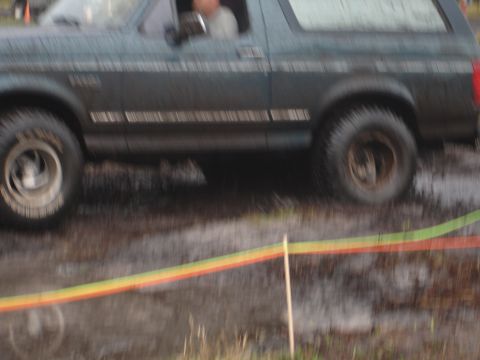 1989 Ford Bronco - This 1989 Ford Bronco navigates a muddy course, likely during an off-road event.