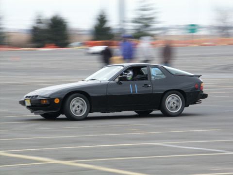 2001 Mercury Grand Marquis - A black coupe is seen on a race track with motion blur.