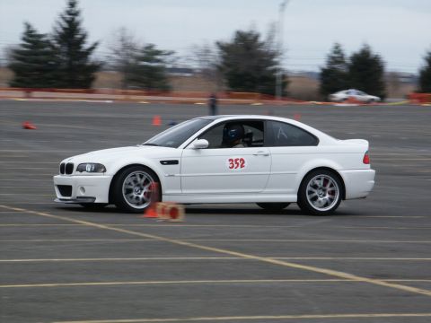 2001 Mercury Grand Marquis - White BMW M3 coupe with racing number 352 on the door is seen on a track during an event.