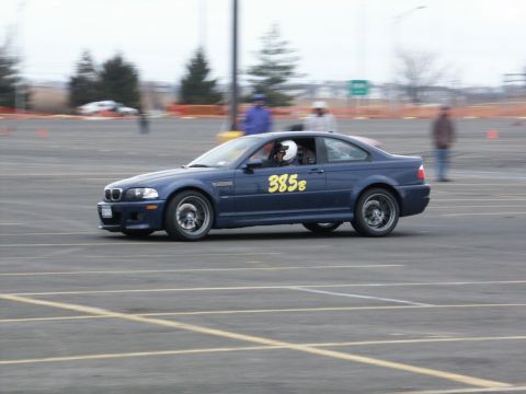 2001 Mercury Grand Marquis - A blue coupe with racing numbers is seen on a track during an event.