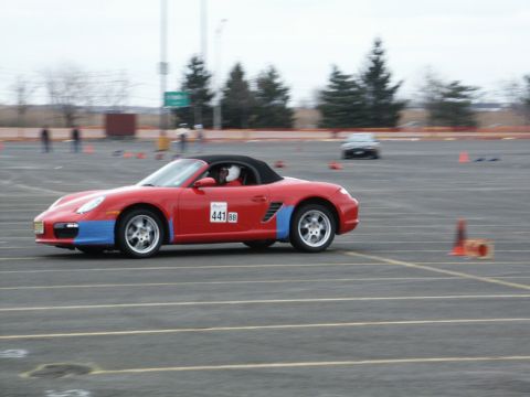 2001 Mercury Grand Marquis - A red convertible sports car with blue accents on the fenders participates in an event, displaying the number 441 on its door.