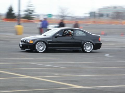 2001 Mercury Grand Marquis - Black BMW M3 coupe on a track, likely participating in an event.