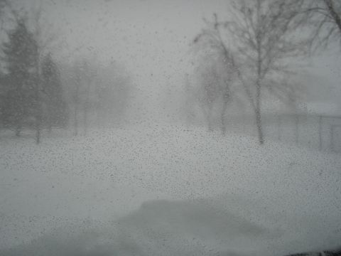 1990 Ford Bronco - A winter scene viewed through a rain-streaked windshield, with the Supermotors logo in the corner.